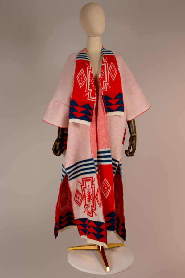 "Elegant Tribal Radiance Abaya featuring vibrant red and blue tribal patterns on premium wool fabric, perfect for cooler weather and stylish occasions."